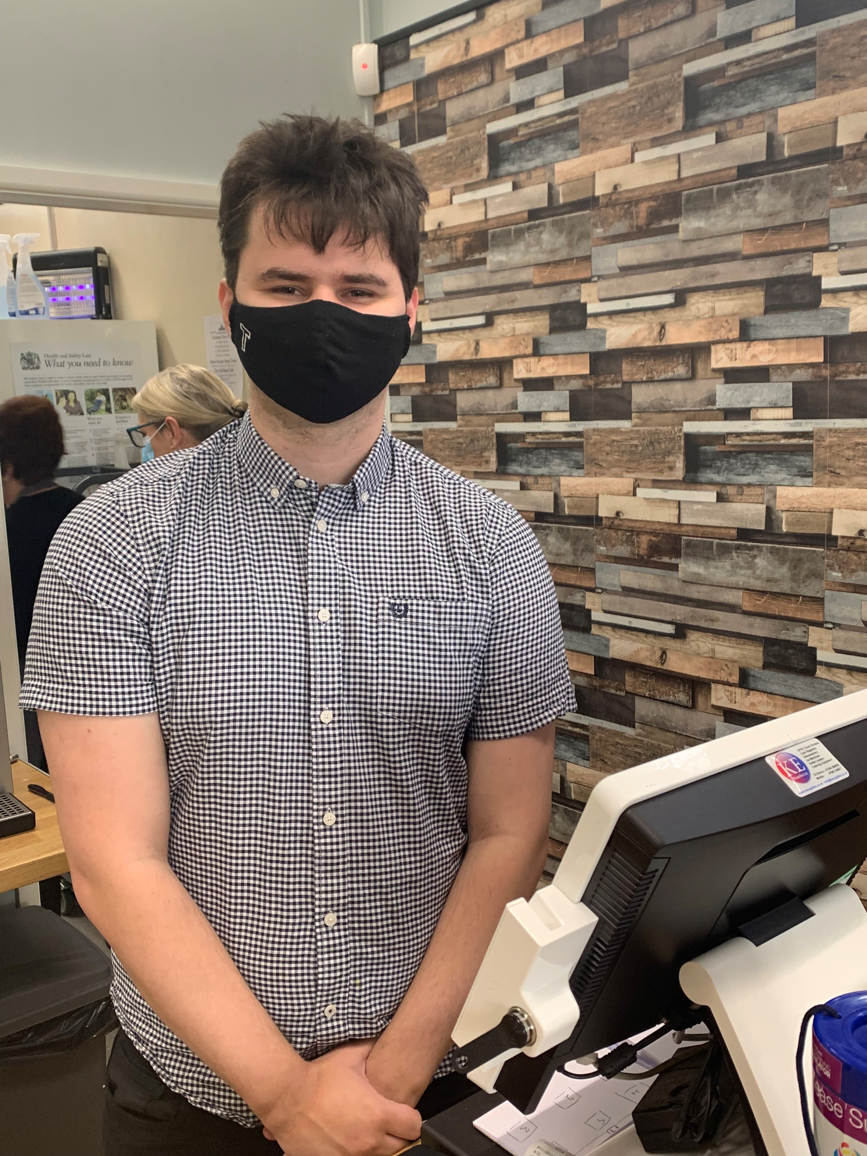 Tom behind the counter at the Old Bank Cafe